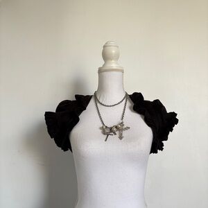 Black lip service ruffle bolero.